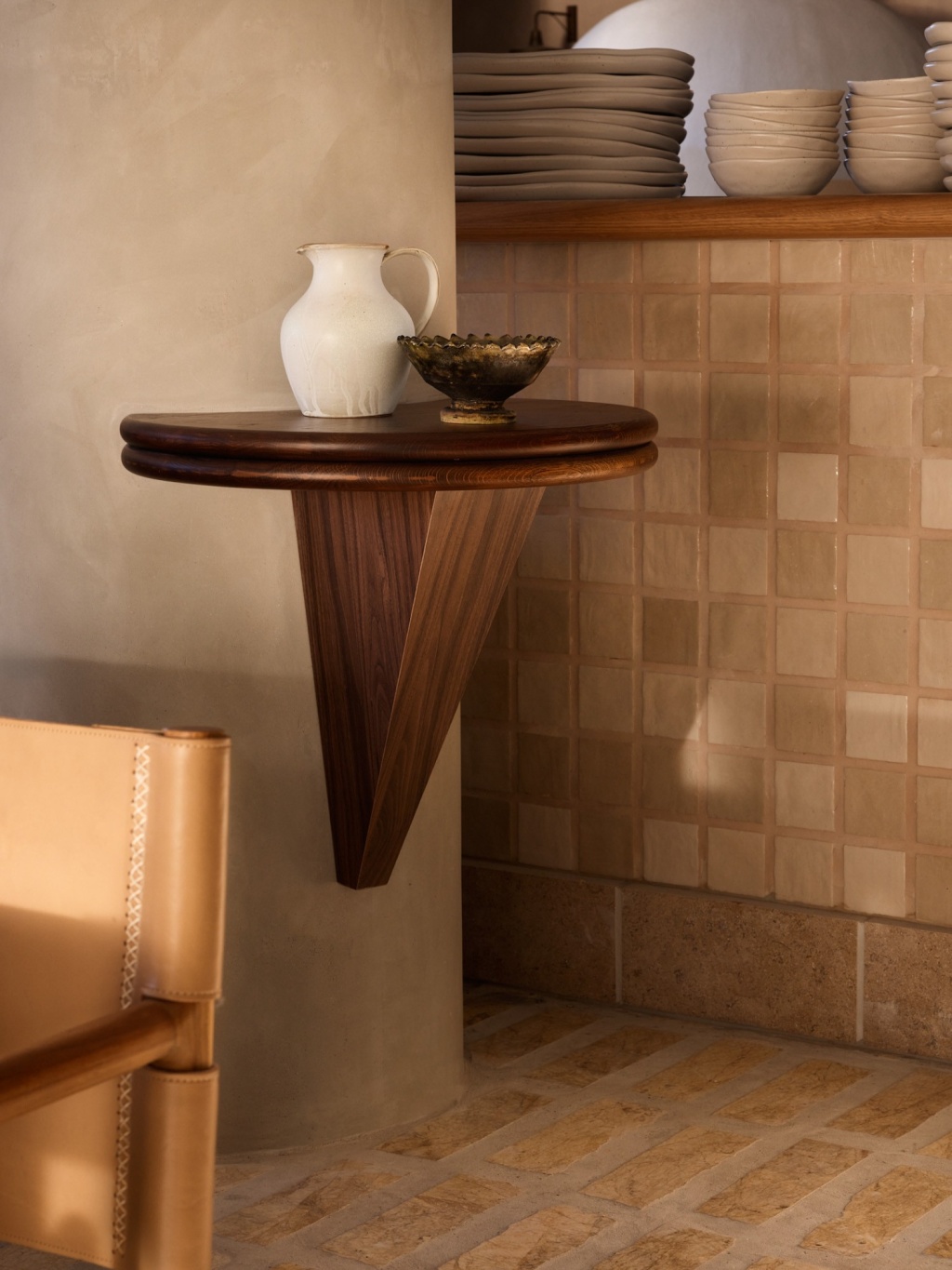 Custom round wall ledge attached to concrete column.
