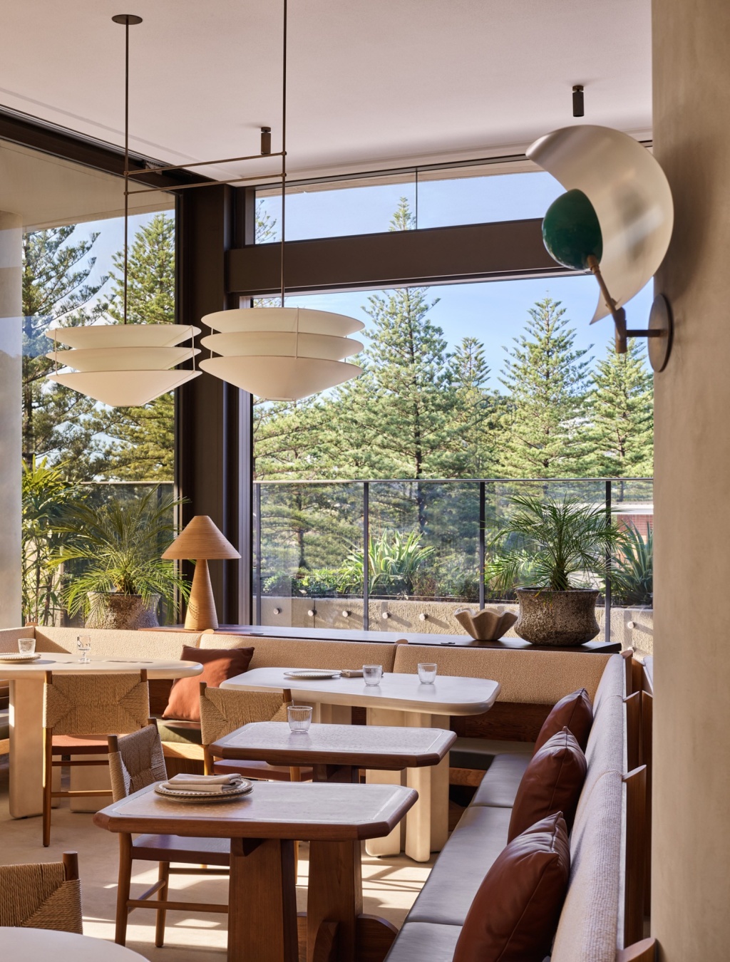 White light pendant and custom furniture at Haven.
