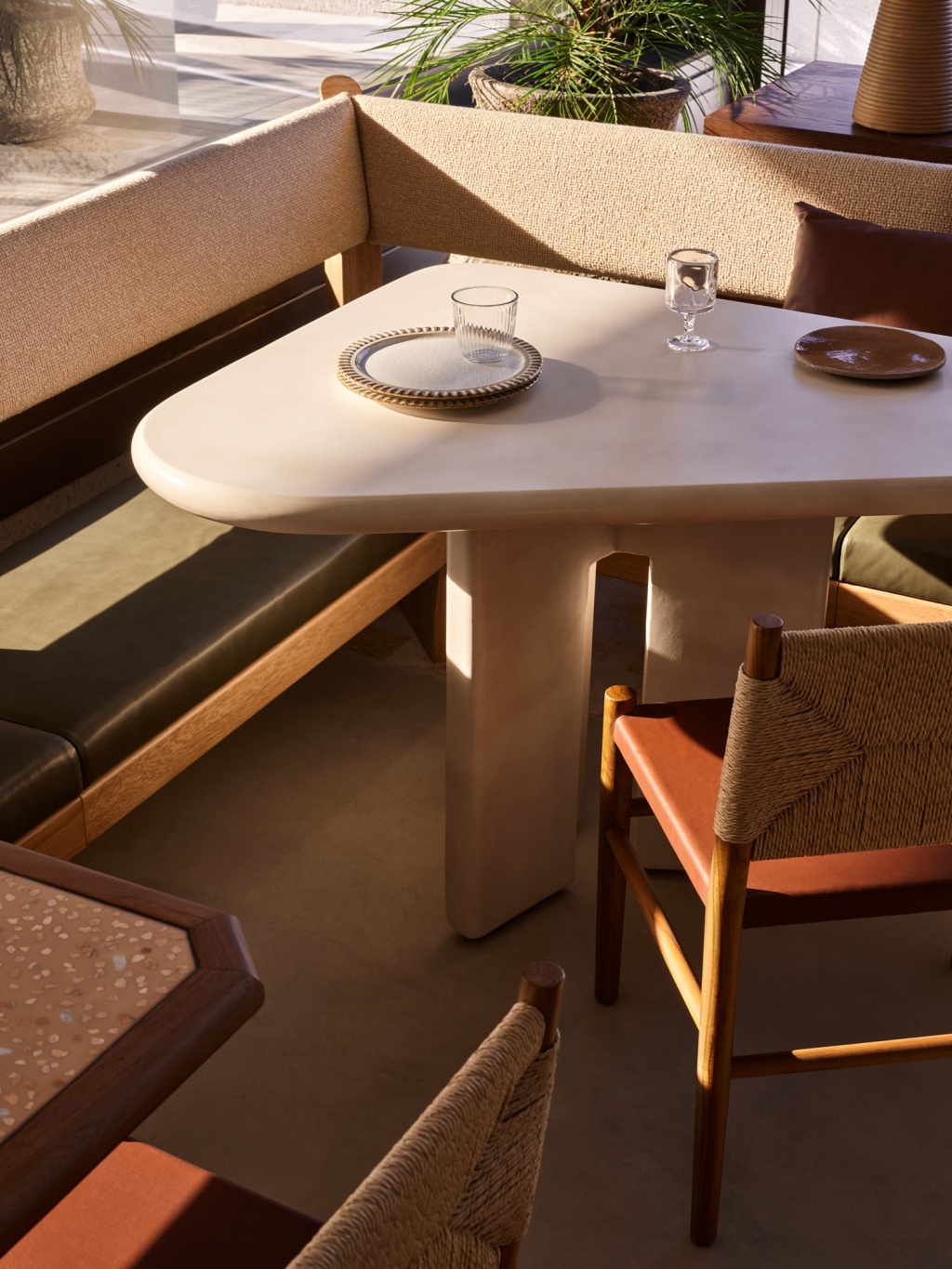 Detail of curved concrete and banquette seating at Haven.