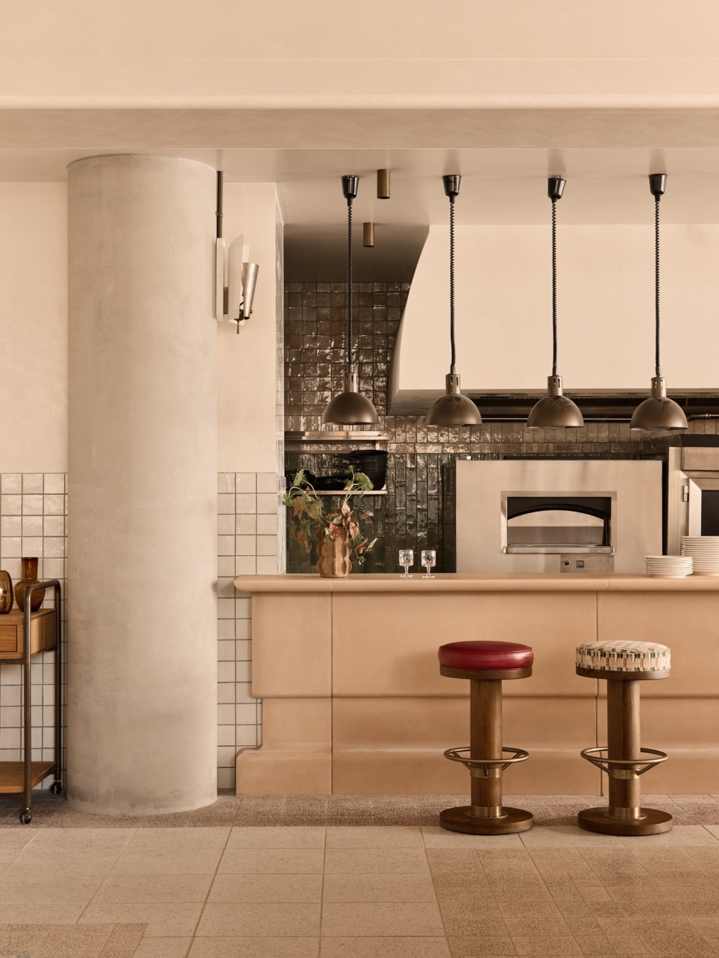 Blush concrete kitchen pass at Lito, Mondrian Gold Coast.