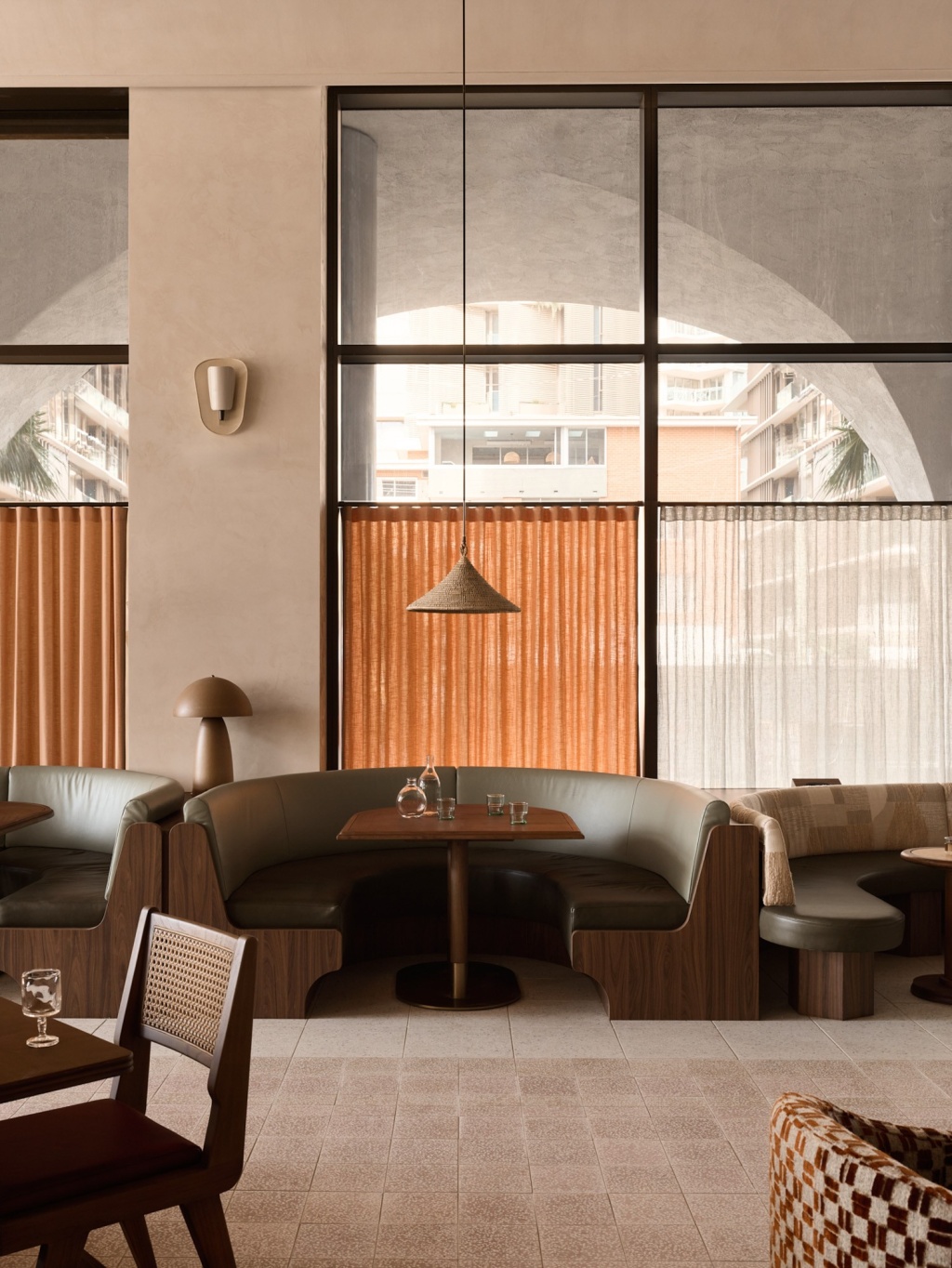 Sage and walnut banquette seating at Lito, Mondrian Gold Coast.