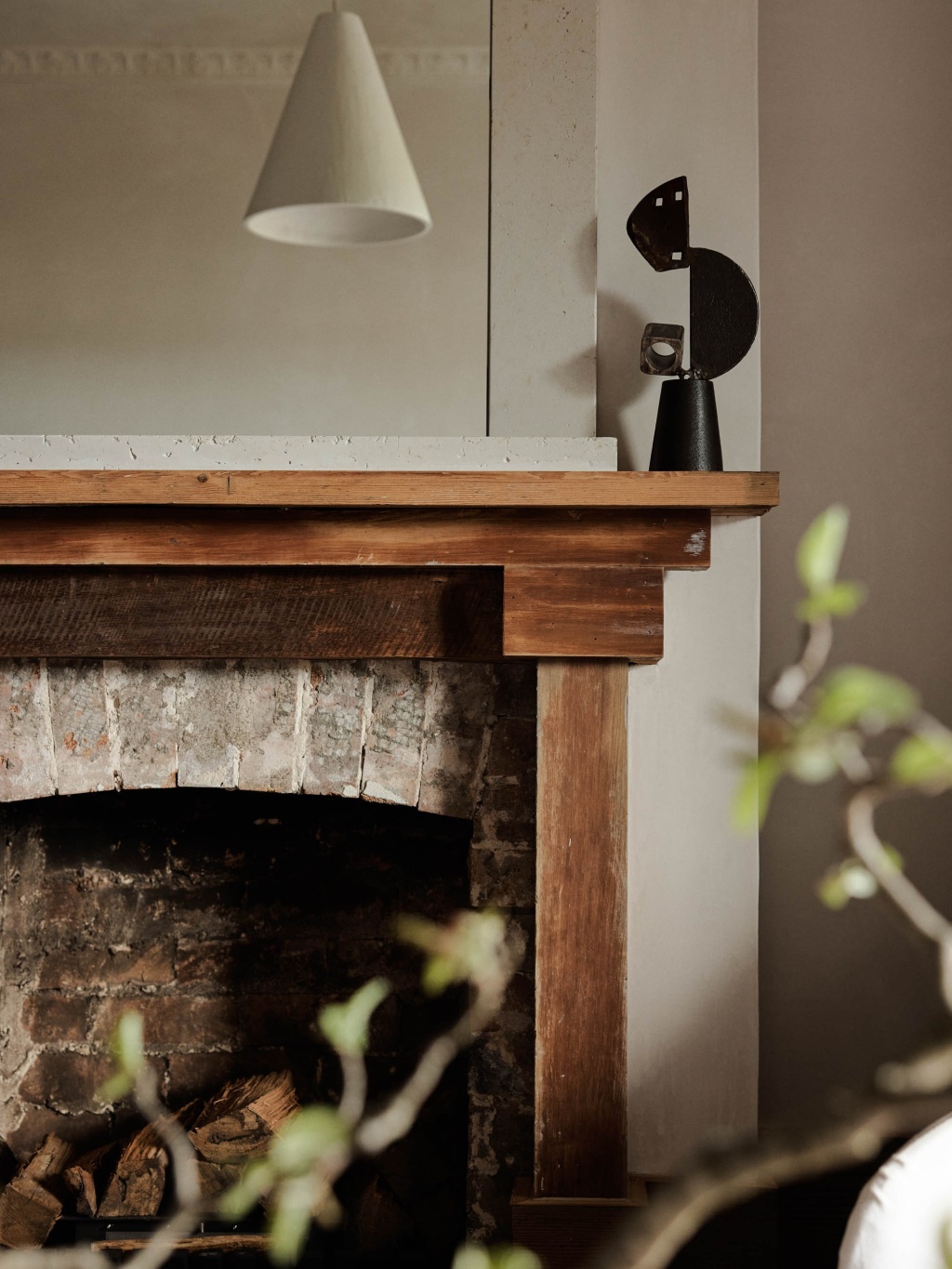 Timber and brick fireplace in The A&CO. Workshop.
