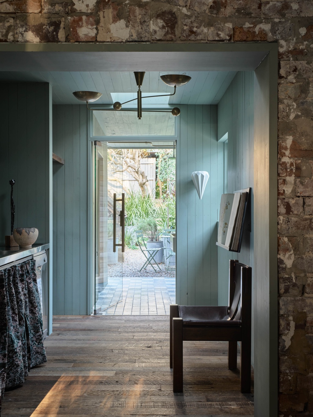 Sage green kitchen of The A&CO. Workshop.
